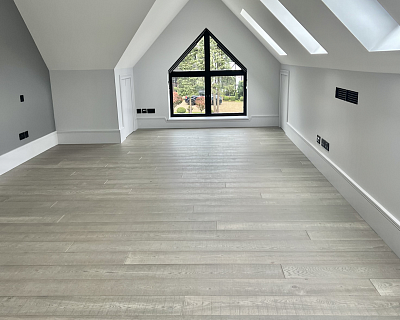 Premium wood flooring and oak stairs in Siena colour for high-end rental property in Hertfordshire
